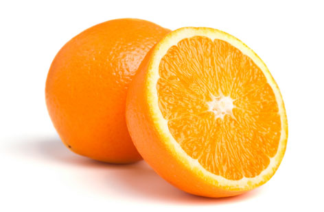 A whole orange next to one cut in half.